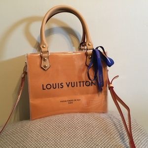 Authentic Louis Vuitton paper bag wrapped in PVC into small, hand held or tote